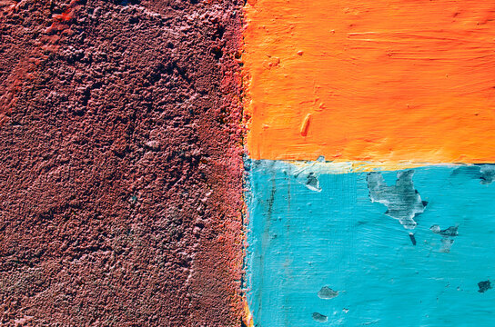 Colorful concrete blocks colored dark red, orange anf blue