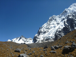Scenic view of the rocky and mountainous terrain, including snow capped peaks, along the Salkantay trek in Peru