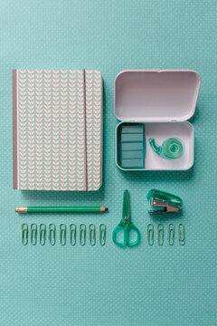 School Supplies On Pastel Mint Green Background
