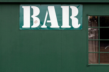 Bar sign outside a temporary event building