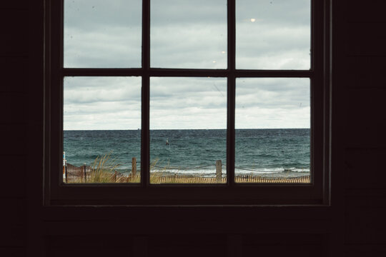 Fototapeta View of a wavy lake through a window frame