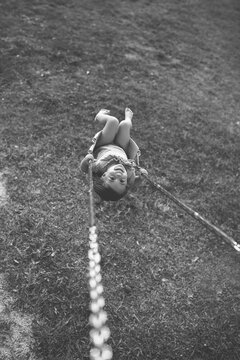 A Little Girl Swinging
