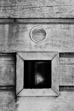 A Circle above a Square that's a Hole in the Wall (wood)