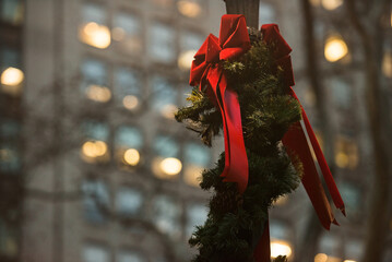 Red ribbon bow and holiday garland