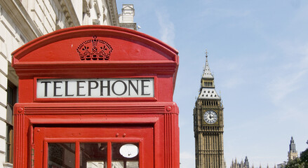 Fototapeta na wymiar Westminster, London with traditional red Telephone box and Big Ben in background.