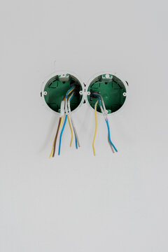 Bare power socket under construction with power cable