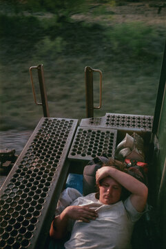 Young Man Sleeping on Freight Train
