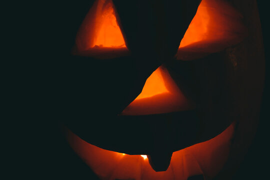 face of halloween pumpkin in closeup .