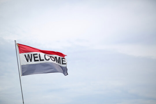 A Welcome Flag Blowing In the Breeze