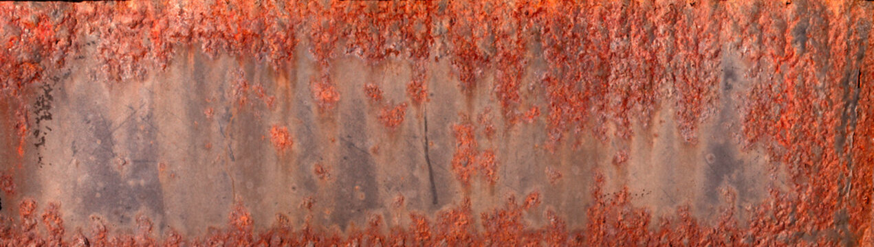 Closeup macro of the patterns colors textures of rusting deteriorating metal steel plates