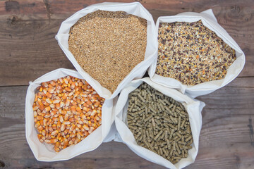 overhead view of bags with grains and pellets for sale at the forage - obrazy, fototapety, plakaty