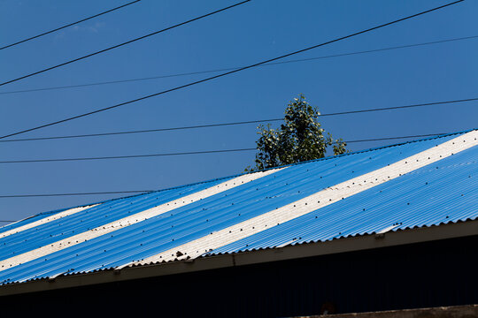 Metal roof with tree and many cabels