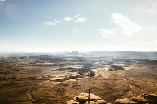 figure overlooking canyonlands