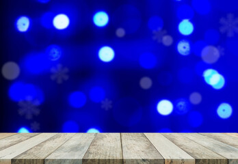 Bokeh for happy new year 2021 concept. Blank wood table on blur abstract blue bokeh for background.