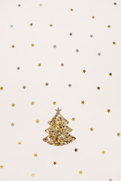 Shiny little stars around a shiny Christmas tree on white background