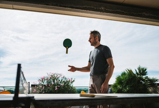 Man playing with a ping pong paddle