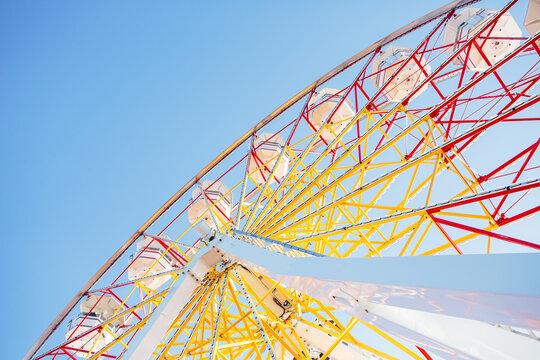 Ferris wheel against blue sky