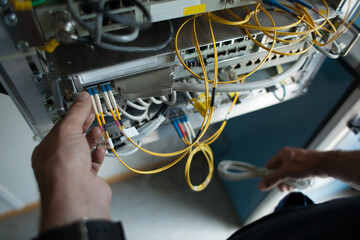 Working with optic fibre cables.