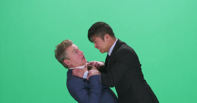 Man in suit yelling and strangling colleague, greenscreen