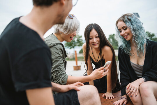 Group of friends having fun with social media