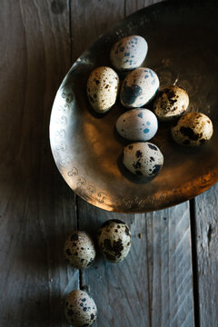 Quail eggs on a pewter dish