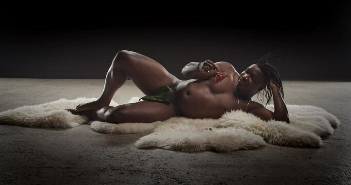 Naked Black Guy With A Fig Leaf Eating Grapes