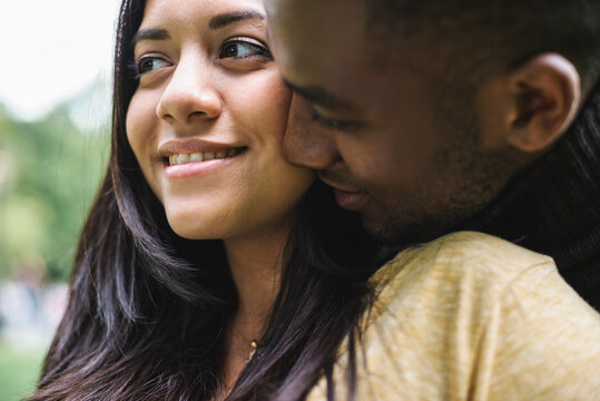 Affectionate and happy black couple together outdoors