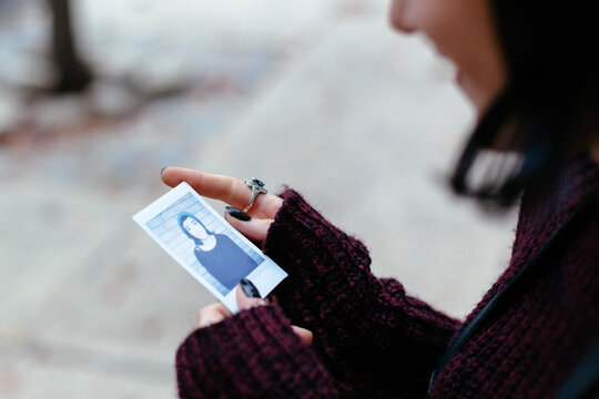 Woman holding a Polaroid