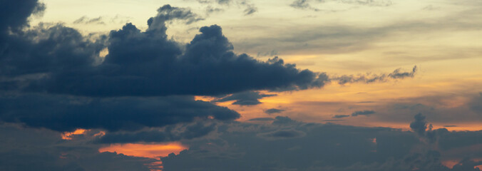 Beautiful sunset sky above clouds with dramatic light.