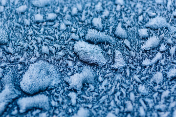Frosty buildup on a blue surface