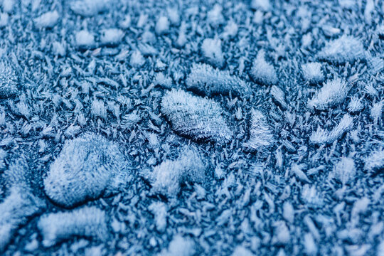 Frosty buildup on a blue surface