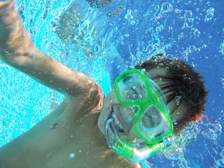 Happy Cheerful Swimming Boy