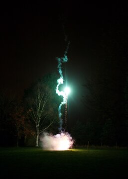 Firework rocket launching in a garden