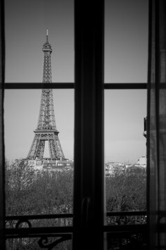 The Eiffel Tower, Paris, France, viewed through a window.