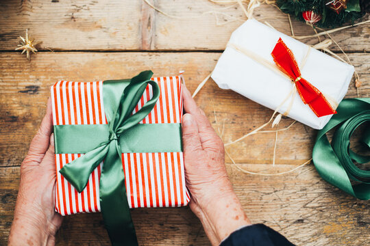 Old Woman Wraps Gifts for the Holidays
