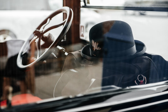 Vintage bowler hat inside an antique car