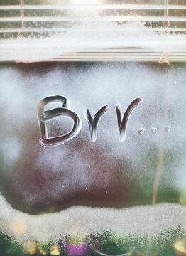 Brr..."" word on a frozen window