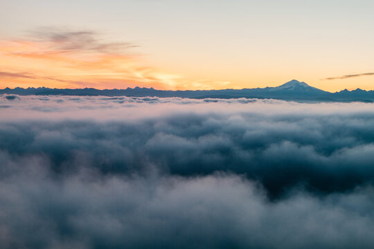 Aerial view of thick low clouds and mountains at sunrise