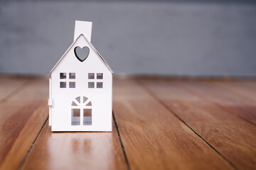 mini house on a timber floor. Image for real estate, renovation, home investment