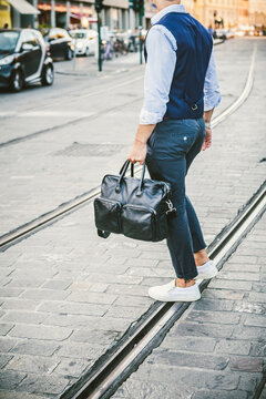 Modern Fashionable Commuter with Leather Bag Crossing the Street