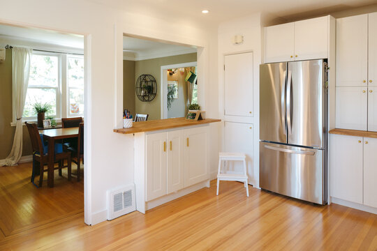 Bright, modern kitchen no people and wood floors countertops