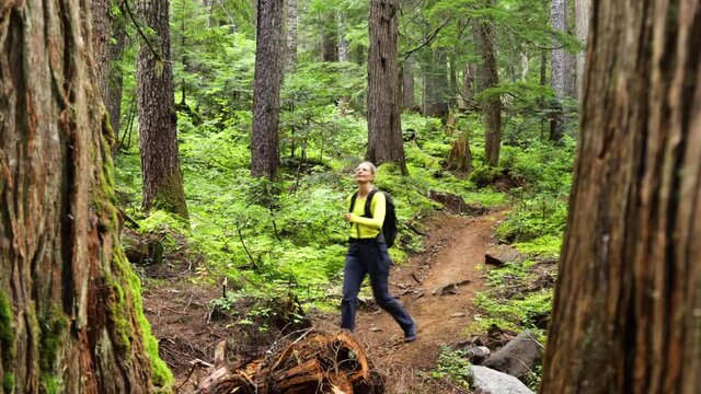 Woman Hiking In The Forest