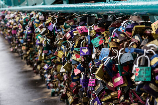 Locks as a symbol of love fastened to a bridge