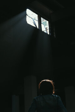 Woman Looking at the Sun Rays