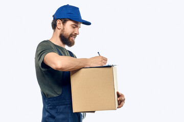 Working male courier with box in hand documents delivery service light background