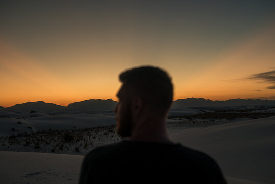 A man enjoying the sunset over White Sands