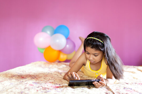 A little girl browsing with Tab