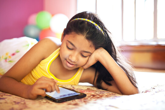A little girl browsing with Tab