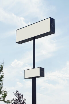 Large,blank white billboard against sky