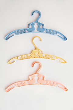 a set of three baby vintage clothes hangers